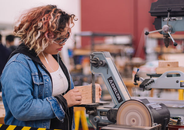 Teenager doing wood work