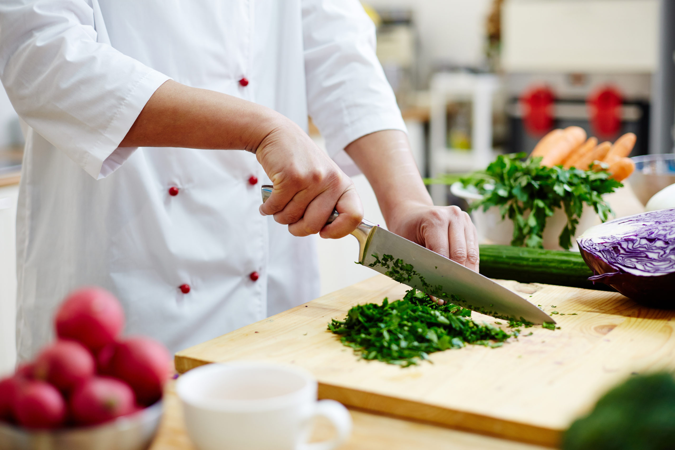 chef cutting greenery